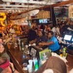 A crowd of people at a bar in Staniel Cay, The Bahamas.