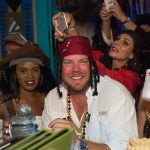 A group of people dressed as pirates enjoying a night out in Staniel Cay, The Bahamas.