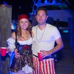 A man and woman dressed as pirates pose for a photo during their vacation on Staniel Cay in The Bahamas.
