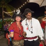 A man and woman dressed in pirate costumes at a party in Staniel Cay, Bahamas.