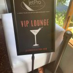 A sign with the words "VIP Lounge" in front of a couch at Staniel Cay Yacht Club.