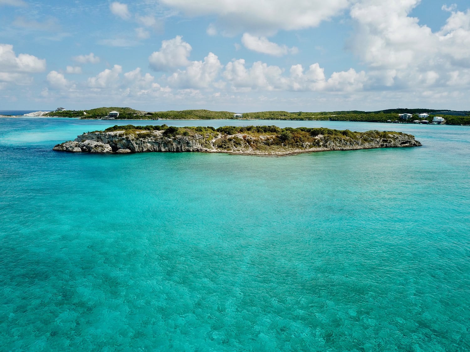 An aerial view of Staniel Cay, one of the stunning islands in The Bahamas, surrounded by turquoise water.