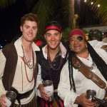 Three men dressed as pirates pose for a photo at Staniel Cay in The Bahamas.