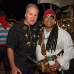 Two men dressed as pirates pose for a photo during their vacation in The Bahamas.