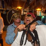 Two men dressed up as pirates in a bar at Staniel Cay Yacht Club in The Bahamas.