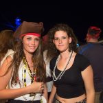 Two women dressed as pirates enjoy a lively party at Staniel Cay.